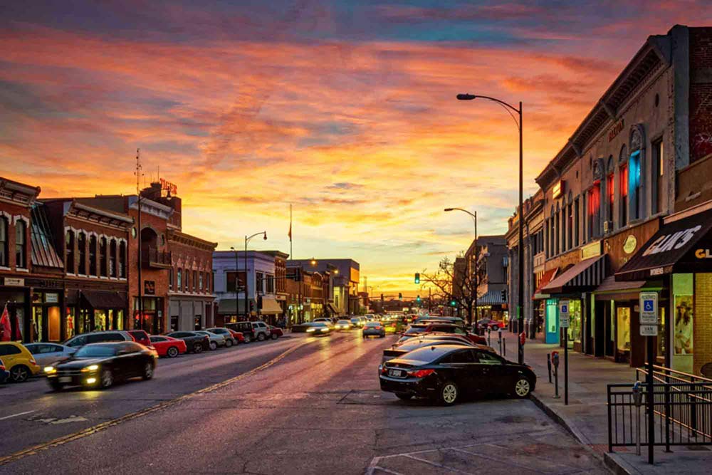 Full width image of downtown Columbia, MO, at sunset.