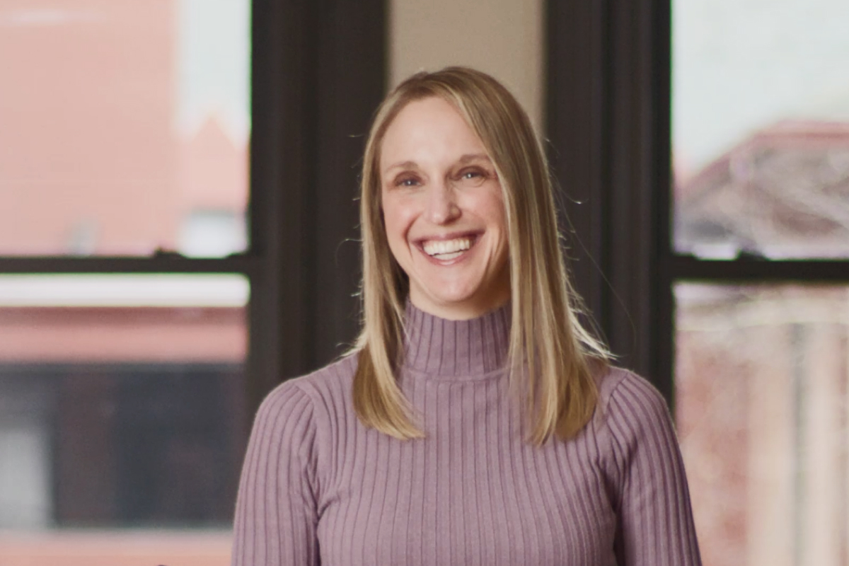 Image of a blonde woman smiling
