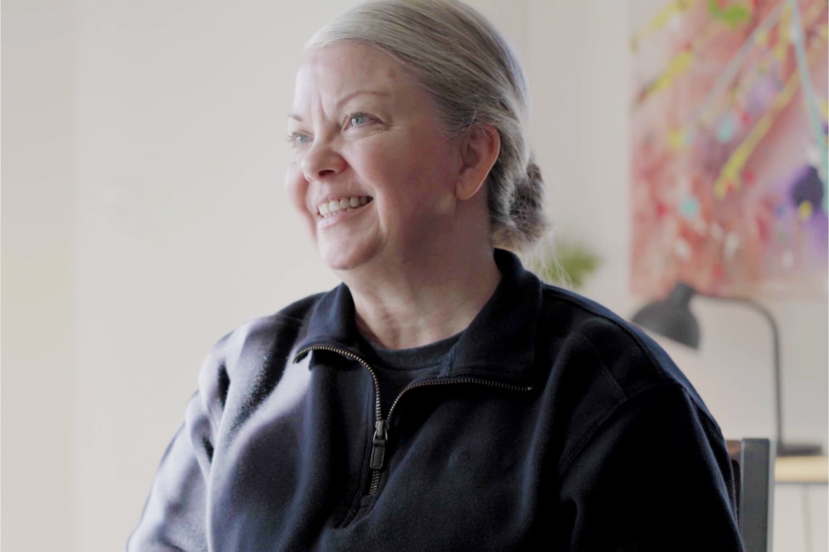 Image of a woman with gray hair smiling
