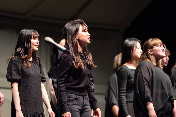 A group of vocalists performing in choir.