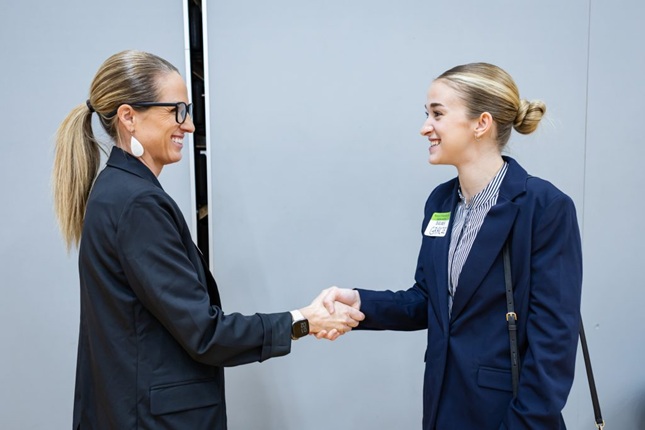 Columbia College Grossnickle Career Services Center Director Amanda Wooden shakes hands with a student during the annual Career Fair. 