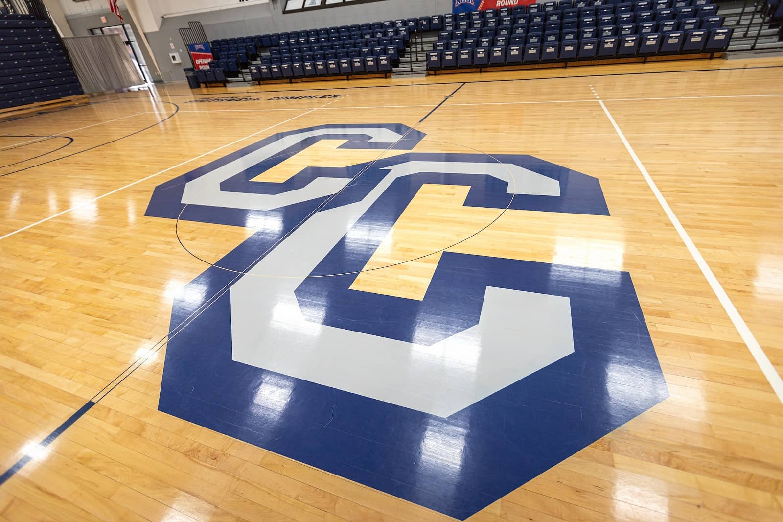 CC logo on the floor of the basketball court.