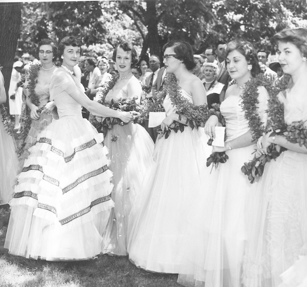 Historical image of women students dressed in gowns celebrating the Ivy Chain ceremony.